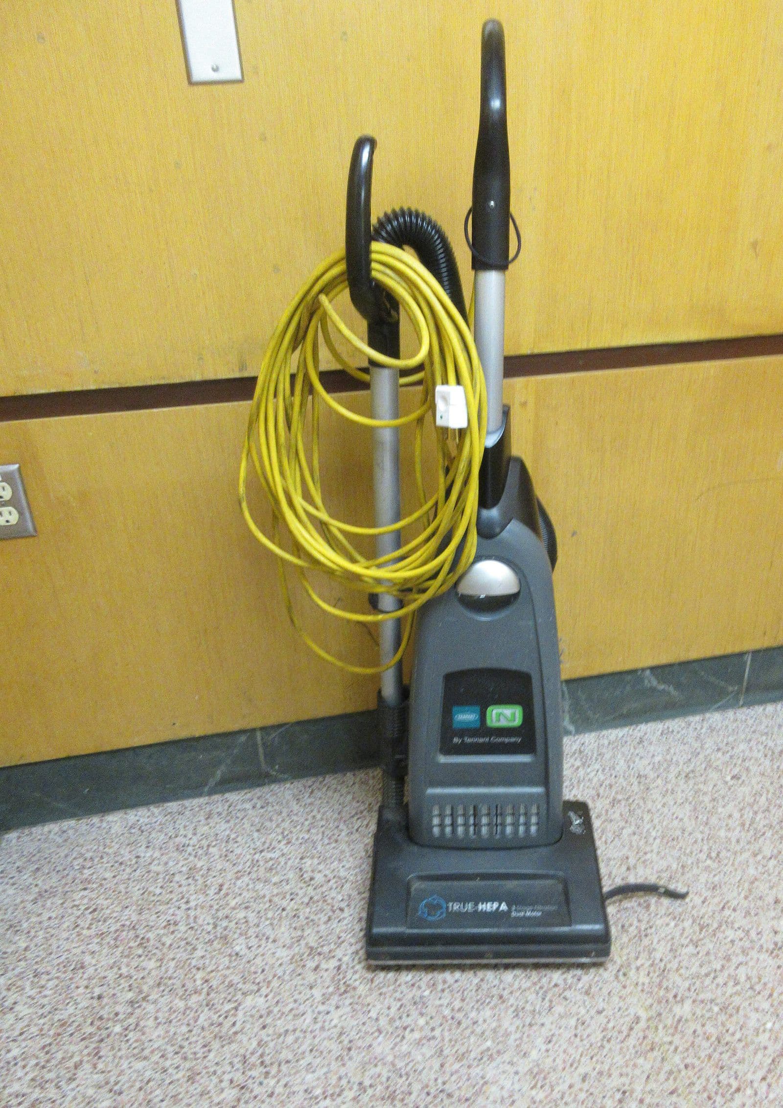 An upright vacuum cleaner with a true HEPA filter