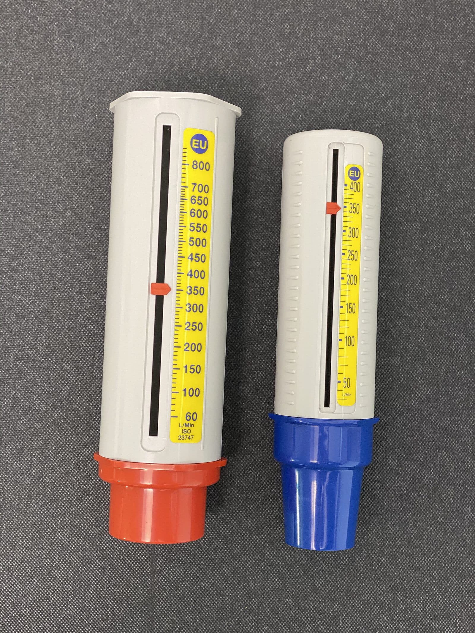 Two handheld peak flow meters used to track breathing