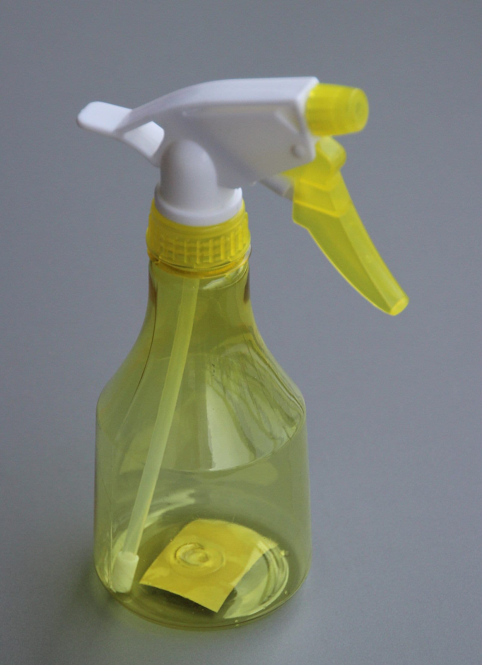 A plastic trigger spray bottle of the kind used for mold cleaning solutions